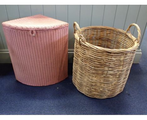 A WICKER LOG BASKET, WITH HANDLES46cm dia, and a Lloyd Loom 'Lusty' corner laundry basket, in pink (2)
