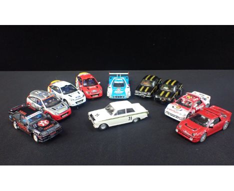 TEN UNBOXED SCALEXTRIC 'FORD' CARS&nbsp;Including 'Escort RS 1800', 'Focus WRC' and 'Lotus Cortina'. Some shown signs of ligh