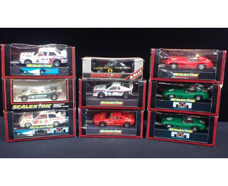NINE BOXED VINTAGE SCALEXTRIC CARSIncluding C288 'Aston Martin DBR', C391 'Ferrari GTO' and C406 'BMW M3 Mobil'. All models a