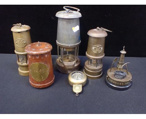 A MINER'S LAMP; 'THE WOLF SAFETY LAMP Co (Wm MAURICE) Ltdtwo other lamps, a miner's brass watch protector (with watch), and r
