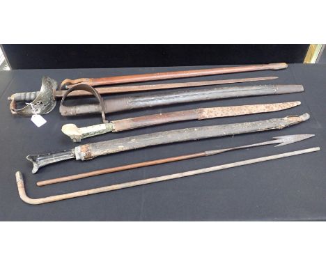 A GEORGE V OFFICERS DRESS SWORDthree other swords, a spearhead, and a silver-mounted stick