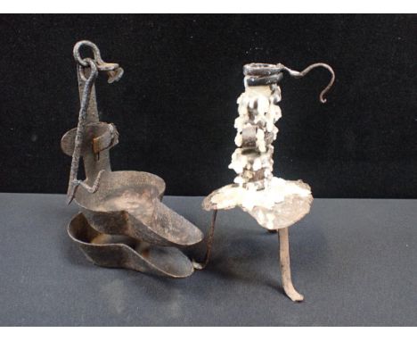 AN IRON CRUSIE LAMPand an iron spiral candlestick (2)