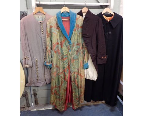 AN OLD SILK DAMASK HOUSECOATwith blue velvet collar, cuffs and buttons (a/f), a cutaway coat in brown wool (later buttons), a