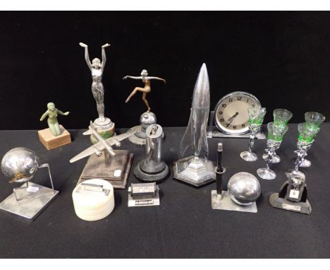 A COLLECTION OF ART DECO DESK ITEMSincluding a spherical clock, inkwell, rocket lighter and other items (some a/f)