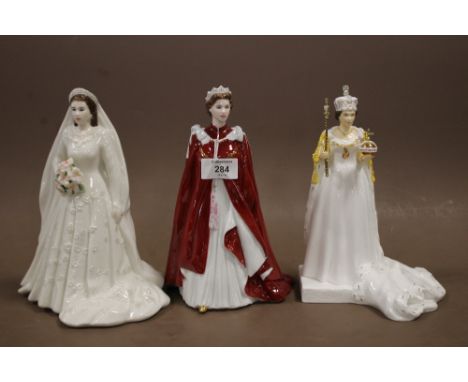 TWO ROYAL WORCESTER QUEEN ELIZABETH FIGURINES TOGETHER WITH ANOTHER  (3)