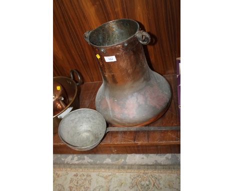AN UNUSUAL COPPER CAULDRON TOGETHER WITH A COPPER LADLE