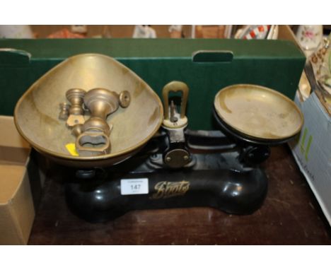 A PAIR OF BOOTS SCALES WITH BRASS WEIGHTS 