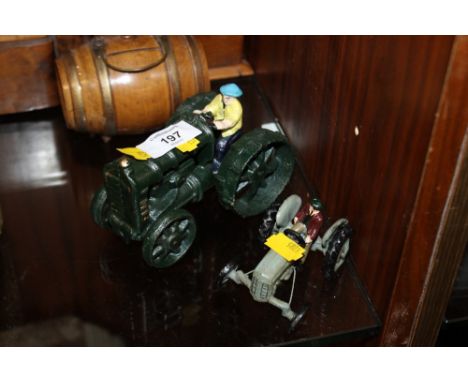 TWO CAST FARMER ON TRACTOR FIGURES 