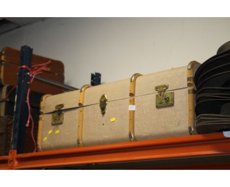 A LARGE VINTAGE TRAVEL TRUNK 