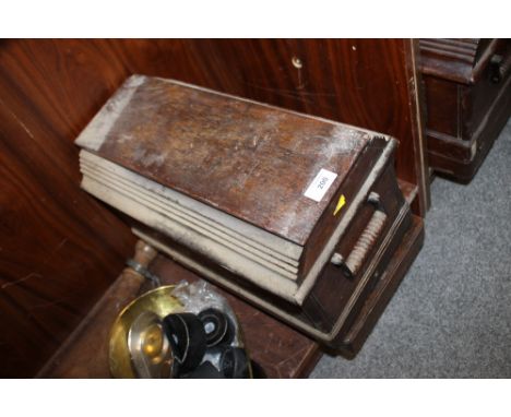 A VINTAGE OAK CASED SEWING MACHINE 