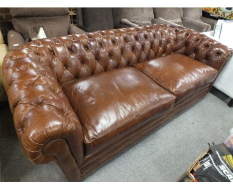 A MODERN BROWN BUTTON BACK CHESTERFIELD SETTEE