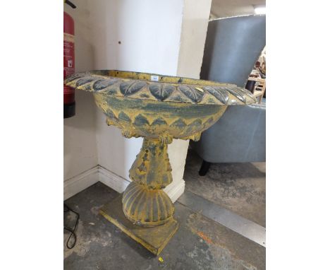 A CAST METAL HALF WALL PLANTER