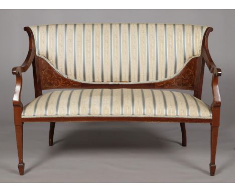 An Edwardian mahogany parlour sofa. With strung and marquetry inlaid decoration. Height 87cm, Width 115cm.