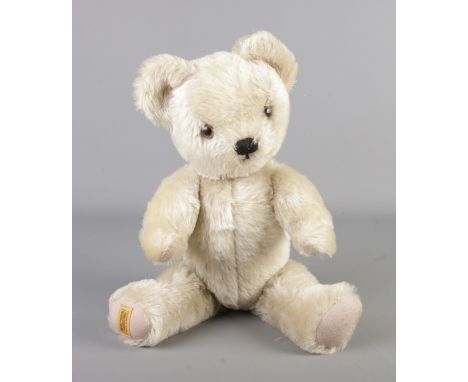A Merrythought jointed musical bear. Seated height 34cm.