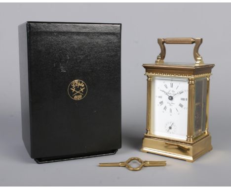 A French L'Epee brass and glass alarm carriage clock. With original box. Height to top of handle 16cm.  Alarm does not chime,