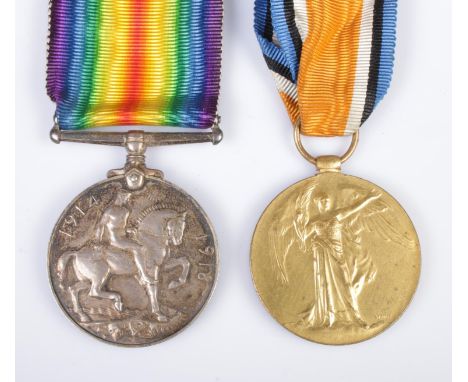 A World War One medal pair awarded to Private J Scott, T4-216838, Army Service Corps.