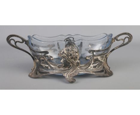 A WMF silver plated centrepiece bowl of art nouveau style featuring portrait of maiden and shaped glass liner. Approx. dimens