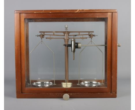 A set of WBN Glasgow scientific chemical scales in mahogany glazed case.