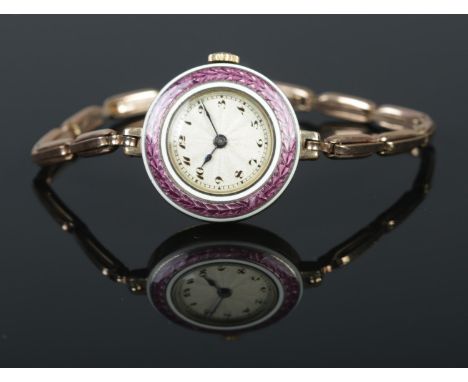 An early 20th century Swiss gold plated ladies manual wristwatch. Having enamel bezel and Arabic numeral markers.  Running. D