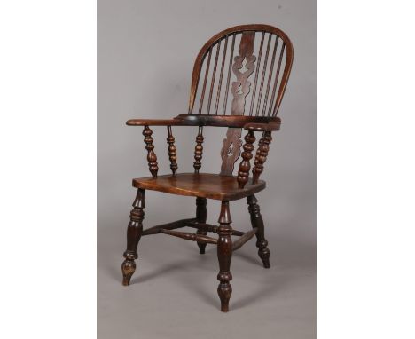 A 19th century ash/elm Windsor arm chair. Having pad arms and bobbin turned arm supports. Height of back 114cm.