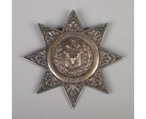 A Victorian silver Ancient Order of Foresters sash badge, having foliage and wreath relief design with central Stag's head an