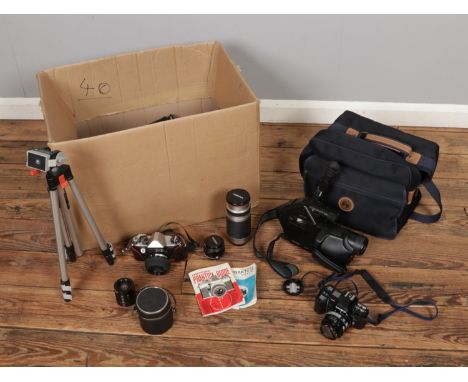 A collection of assorted cameras to include Minolta 7000, Praktica Super TL, Blaupunkt CR-6000S camcorder, tripod, lenses, et