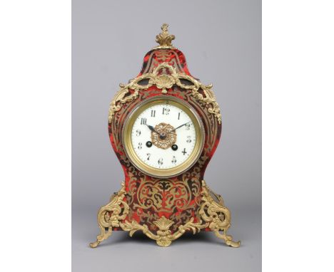 A French ebonised and boulle work eight day mantel clock with gilt metal mounts. Chiming on a coiled gong. With pendulum and 
