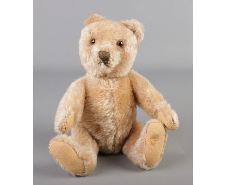 A Steiff mohair centre seam jointed bear. With ear stud. Seated height 23cm.