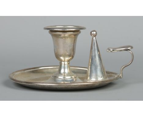 A Victorian silver chamber stick with snuffer and detachable nozzle. Bearing coat of arms and Latin motto 'Honi soit qui mal 