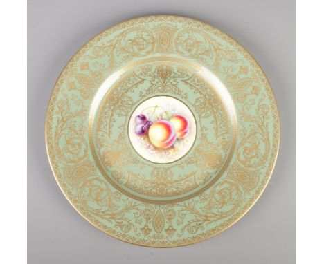 A Royal Worcester cabinet plate. Having hand painted central panel depicting fruit, signed R Price. Diameter 27cm.