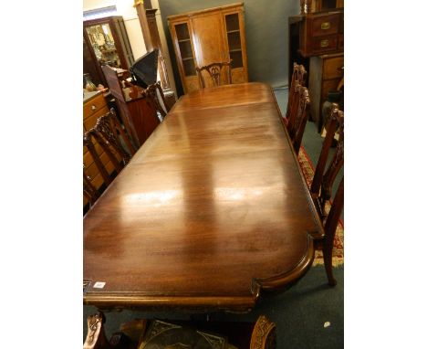 A mahogany dining room suite comprising of eight (2 and 6) Chippendale style chairs with carved decoration and pierced splats