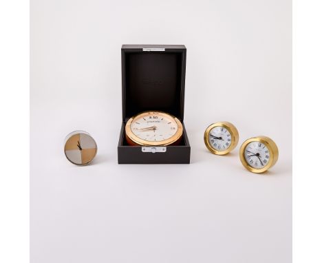 Comprising three identical brass Tiffany clocks, a mixed metal Gucci clock, and a Chopard brass and leather clock with leathe