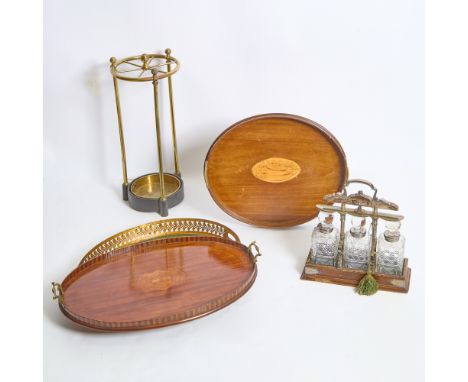 Including a silver plated tantalus, height 14 1/4 inches, width 13 3/4 inches; three galleried trays, length of largest 25 1/