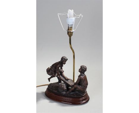 Spelter table lamp, the shade above children playing on a seesaw 