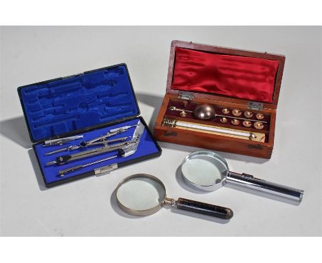 Sikes hydrometer, cased, together with two magnifying glasses and a Jakar drawing set (4)