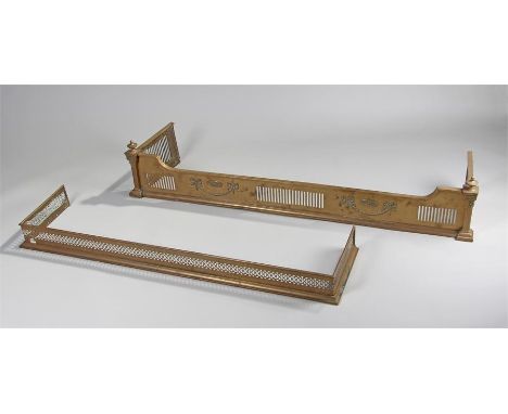 Two 19th Century brass fenders, the first with urn finials above a pierced front and ribbon tied swags, 140cm long, 26cm high