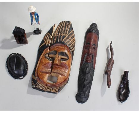 Tribal objects, to include two masks, a painted figure a carved lizard, a bowl, a carved figural scene and a spoon, (6)