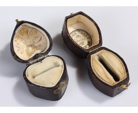 Two ring boxes, the first clad in leather in the form of a heart, the second also clad in leather, (2)