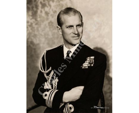 AN AUTOGRAPHED PHOTOGRAPH OF PRINCE PHILIP, CIRCA 1951 signed 'Baron' in Indian ink (lower right) and signed on mount slip Ph
