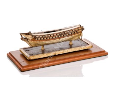 AN EARLY 19TH CENTURY FRENCH NAPOLEONIC PRISONER-OF-WAR WOOD AND BONE SHIP MODEL FOR A 74-GUN FRIGATE unrigged, the 10in. pla