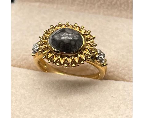 9ct yellow gold ring set with a cabochon gem stone flanked by diamond stone shoulders [3.60grams] [Ring size N] 