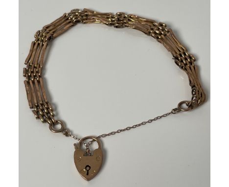 9ct yellow gold gate bracelet with heart lock. [6.53grams] 
