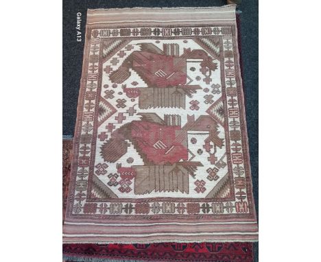 A Light Aztec hand made wool rug [190 x 130cm]. 