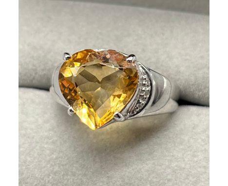 9ct white gold ring set with a heart shaped cut citrine stone. [Ring size O] [4.57Grams] 