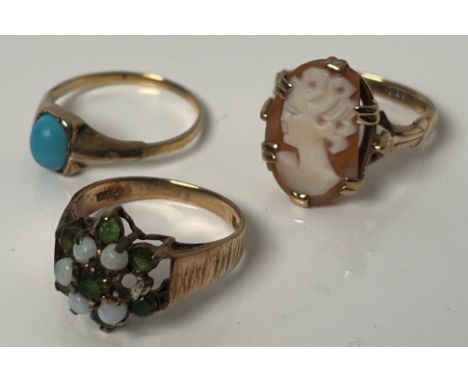 Two 9ct yellow gold rings and one other; 9ct gold and carved cameo ring- ring size M, 9ct gold opal and green stone ring- mis