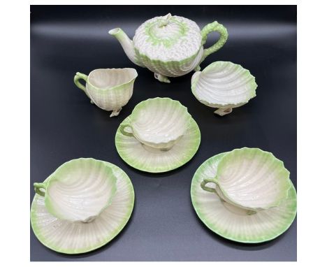 Antique Belleek shell design tea pot, sugar bowl, cream jug, three cups and three saucers. All with black stamp [1891-1926]