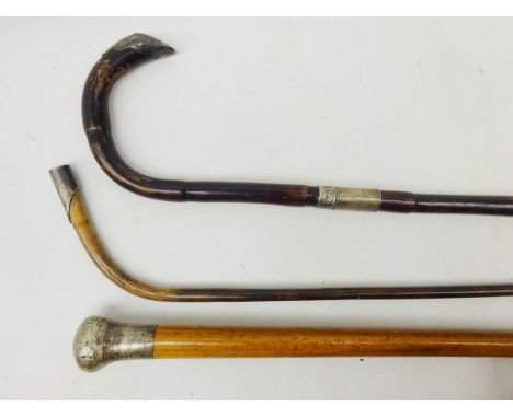 Victorian silver mounted walking stick, the handle inset with an enamel Union flag, B'ham 1899 and two other silver mounted w