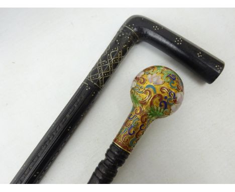 19th/ early 20th century Indian ebonised pique walking stick, L89cm and another with globular Cloisonne pommel (2) Condition 