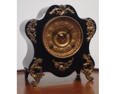 19th century cartouche shaped mantle clock, ebonised case with gilt metal leaf mounts, 'Ansonia Clock Co.' twin train movemen