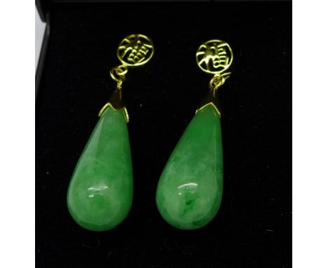 A pair of silver gilt and jade earrings